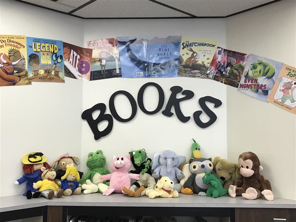 Display of book covers and stuffed animals Display of book covers and stuffed animals